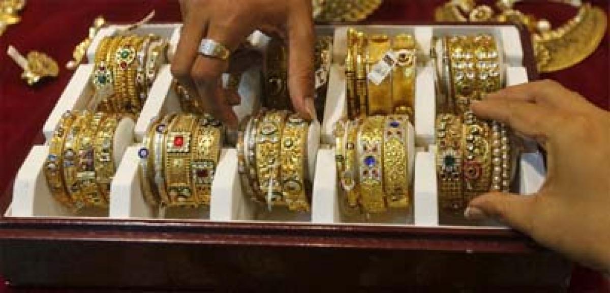 Gold prices fall Rs 123 in futures trade on global cues